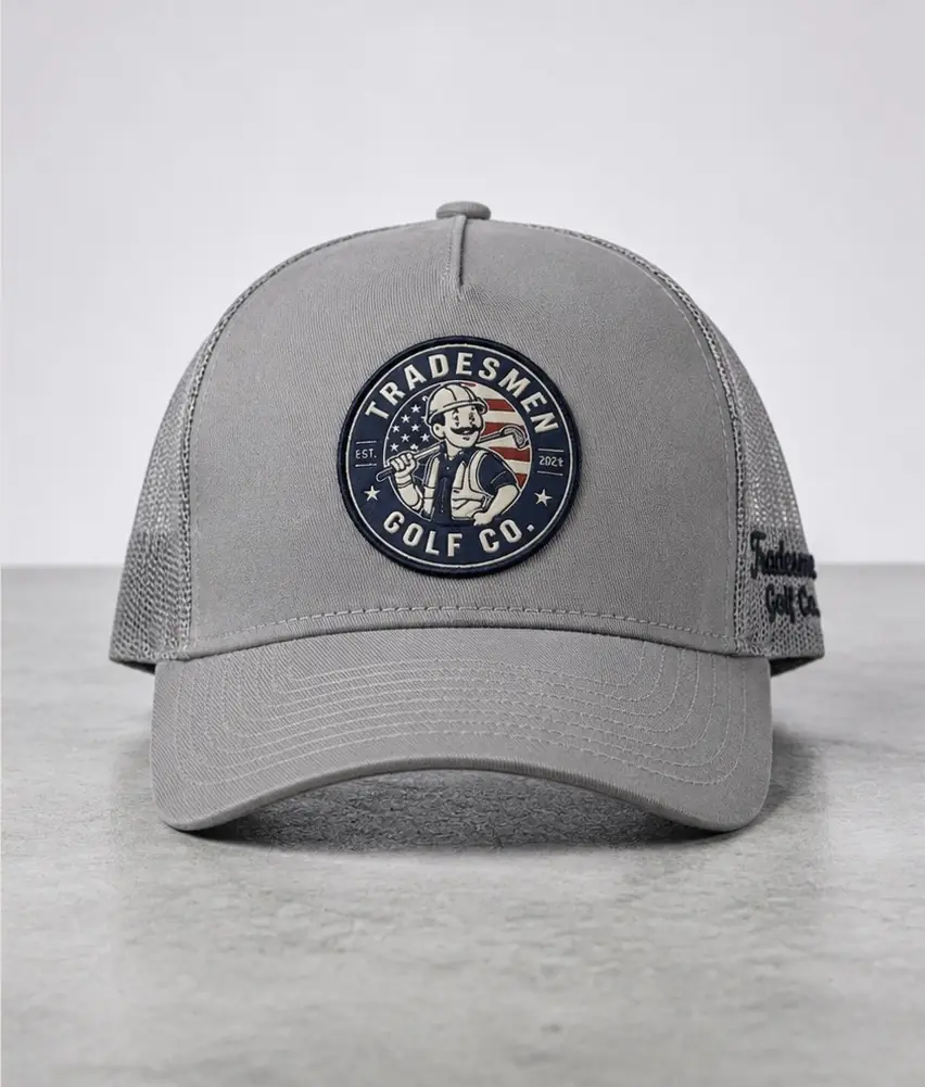 Gray Tradesmengolf launch hat concept photographed on a light background